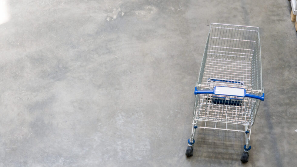 Shopping cart on the floor of a store front end